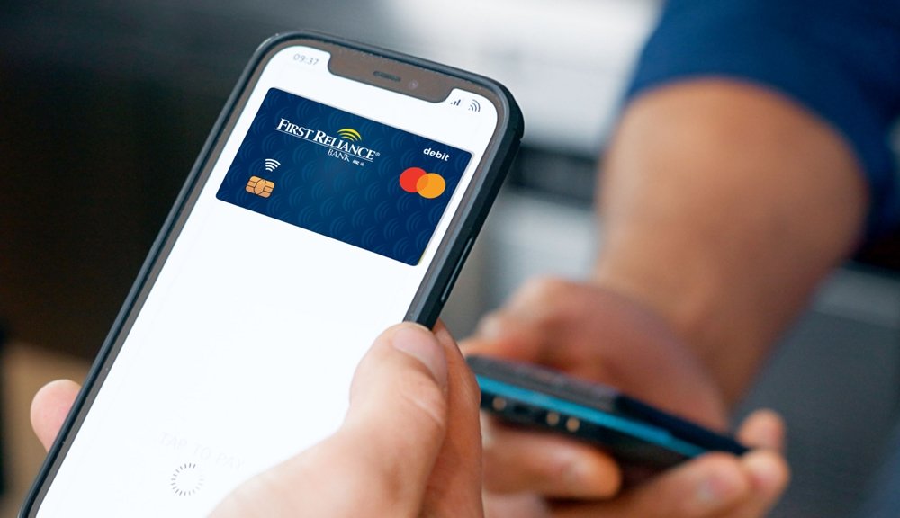 A person paying using First Reliance Bank card from Digital Wallet