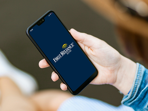 First Reliance Bank logo on phone screen.
